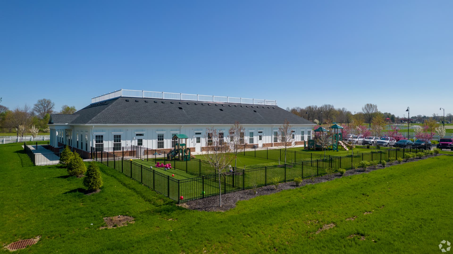 Aerial view of The Barrington School New Albany East, its playgrounds, and grounds